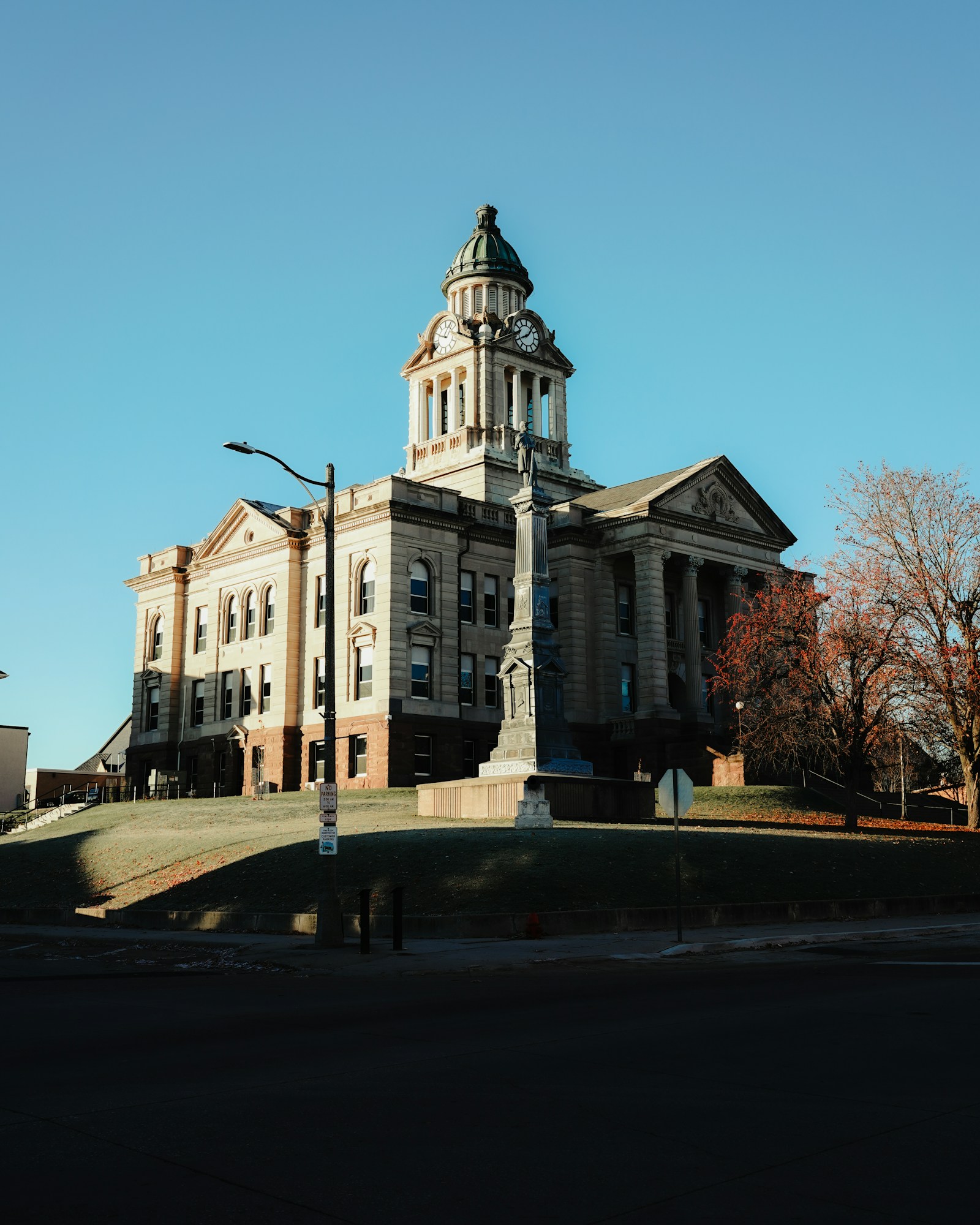 A county courthouse with a clock tower against a clear sky
