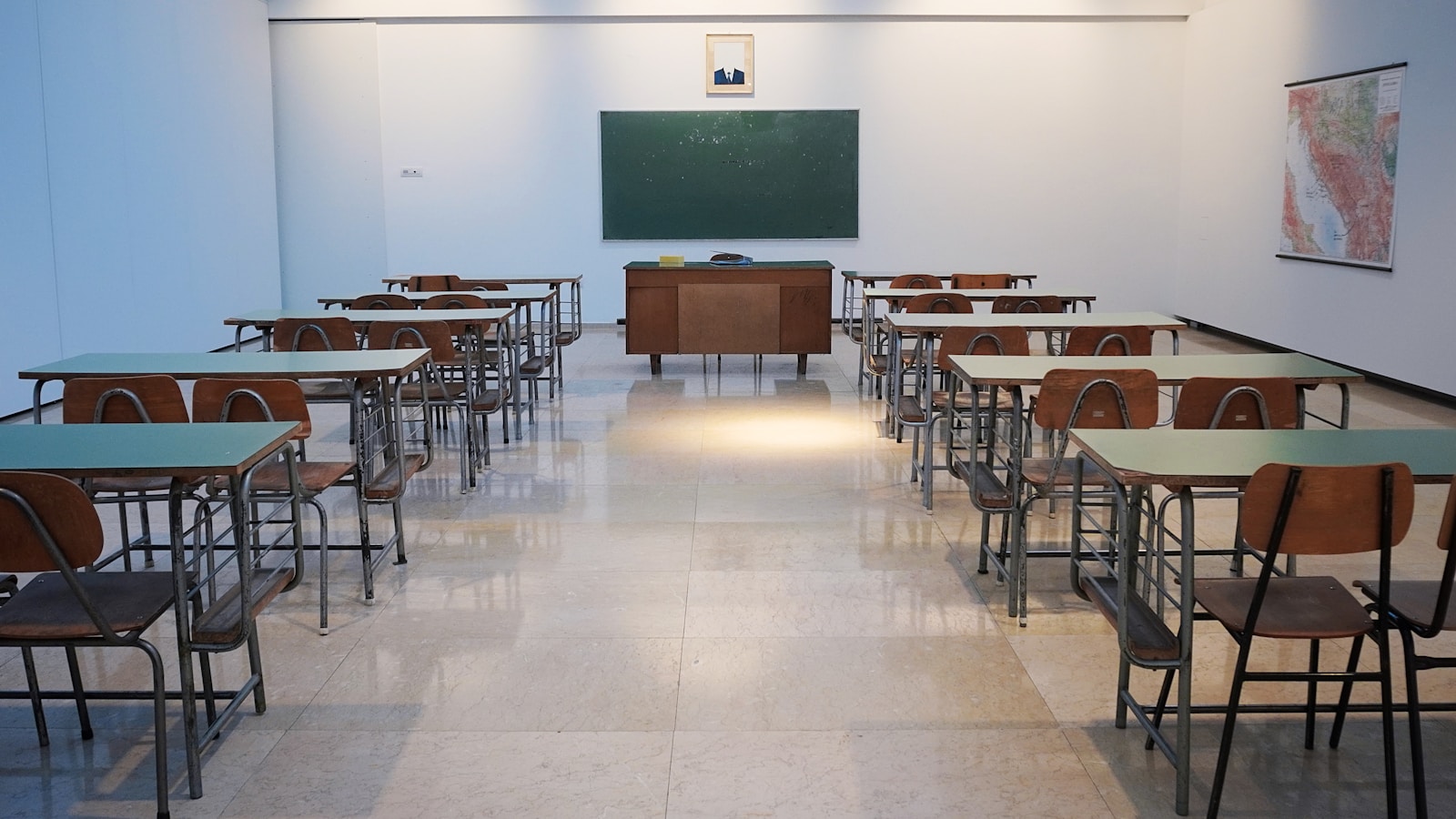Rows of desks in an empty examination room